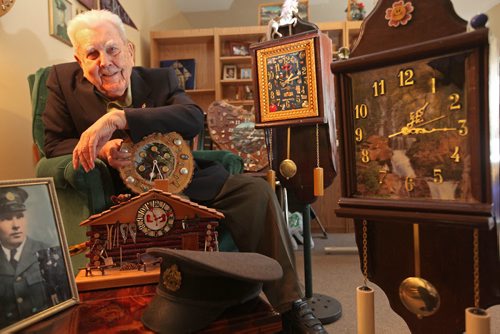 Ninety seven year old military veteran Joe Kutcher also known as "Digger Joe" surrounds himself in his small, quaint suite with time pieces he has made from various pieces of material he comes across like scrap wood, and metal objects he has found over the years.  Feature story by Gordon Sinclair.  April 26,  2012 (Ruth Bonneville/Winnipeg Free Press)