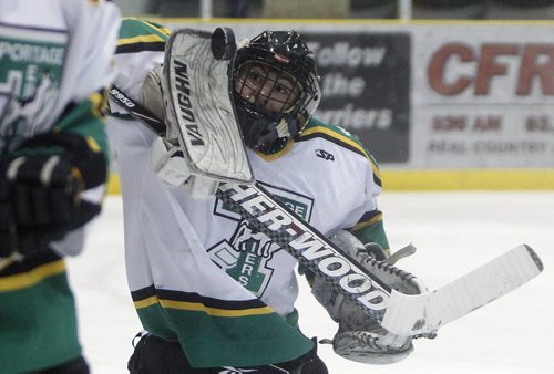 Portage Terriers goaltender, Adam Iwan, makes a blocker save during the first period of action during game 5 of ANAVET Cup Finals against the Humboldt Broncos at the PCU Centre in Potage la Prairie, Thursday April 26, 2012. (TREVOR HAGAN/WINNIPEG FREE PRESS)