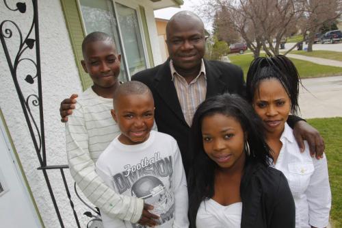 Family who fled Sierra Leone - Allieu Sesay with his wife Zainab, far right, and their 3 kids: (right) Mariama, 17, (left) Mohamed, 12, and (middle) Abass, 7.  April 27, 2012  BORIS MINKEVICH / WINNIPEG FREE PRESS