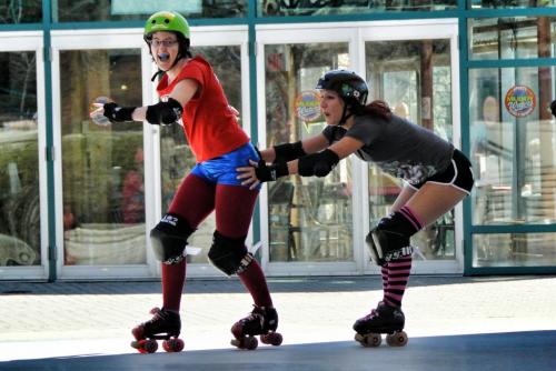 Sarah Cummings (left) and Denise Douglas ham it up during the Winnipeg Roller Derby League open house at the Forks Saturday afternoon.  120428 April 28, 2012 Mike Deal / Winnipeg Free Press