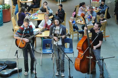 Members of the band Flat City Folk (l-r) Phil Brake, Donovan Locken and Lee Froese perform at the Forks in a effort to win a coveted buskers pass which will allow the trio to busk at the Fork this year.   120428 April 28, 2012 Mike Deal / Winnipeg Free Press