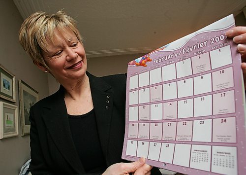 BORIS MINKEVICH / WINNIPEG FREE PRESS  070208 Minister of Labour and Immigration Nancy Allan poses for a photo with a calander. To illustrate that starting next year there will be a long weekend in Feburary.