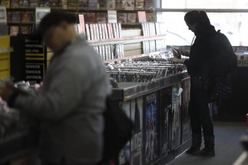 April 30, 2012 - 120430  -  Andrea Boychuk looks through rental DVDs at Movie Village Monday April 30, 2012.  Movie Village is moving down Osborne Street to it's new home at Music Trader. John Woods / Winnipeg Free Press