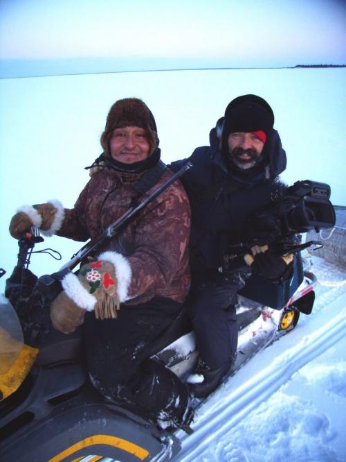 Joseph John (JoJo) Thorassie, left, with director of photography Dave Gaudet on Tadoule Lake. Gaudet captured what promises to be amazing footage while hanging off the back of a snowmobile at minus-40. 2012 Paul Williamson / Winnipeg Free Press