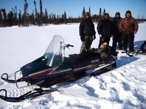 Willy and the hunting party stop for a smoke on Tadoule Lake, the Yamaha Bravo snowmobile was Willy's ride for the day. 2012 Paul Williamson / Winnipeg Free Press
