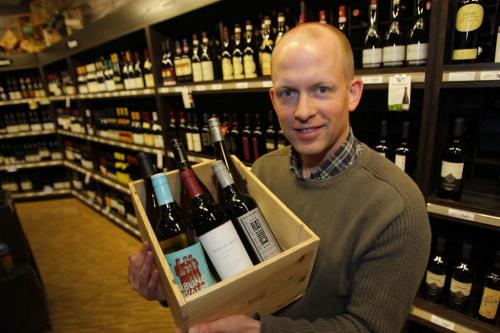 Ben MacPhee-Sigurdson writes about wine in the Winnipeg Free Press. Here he poses with some Canadian wine he is writing about. Photo taken at Madison Square LC. May 3, 2012  BORIS MINKEVICH / WINNIPEG FREE PRESS