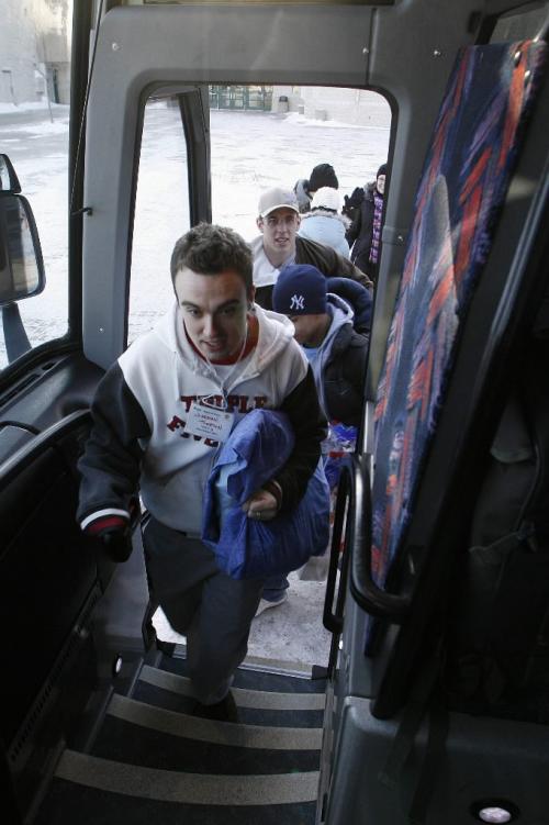 John Woods / Winnipeg Free Press / February - 070209  - Jordan Thompson, U of Manitoba student and one of fifty people going to New Orleans to build a house for Habitat for Humanity, boards a bus with other students at the U of MB. Friday February 9/07.  The group set out today on the thirty hour bus ride to spend their spring break helping build a home.