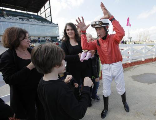 May 6, 2012 - 120506  -  Jockey Paul Nolan punch fists with Teddy Rubenstein (8) as Rubenstein's grandmother Sheila Billinghurst (L) and aunt Tracee Mellon look on after Nolan won the sixth race on The Phenom Sunday May 6, 2012 during the opening day at Assiniboia Downs.    John Woods / Winnipeg Free Press