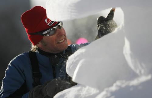 John Woods / Winnipeg Free Press / February 10/07 - 070210  - Snow sculptor Doug Bisson puts the finishing touches on the team USA sculpture at the Festival du Voyageur Saturday Feb 10/07.