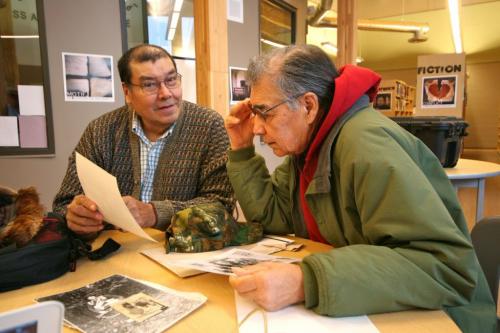 Photo by Vanda Fleuy Elders William G Lathlin and Moses Bignell of Opaskwayak Cree Nation, reviewing resources in the library of Oscar Lathlin Collegiate. for Carol Sanders story in Winnipeg Free Press