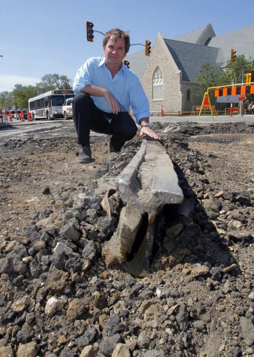 Steven Stothers, Co-chairman of the restoration committee for Winnipeg Streetcar 356 poses for some photos at Broadway and Osborne where some old tracks are being dug up. May 9, 2012 BORIS MINKEVICH / WINNIPEG FREE PRESS