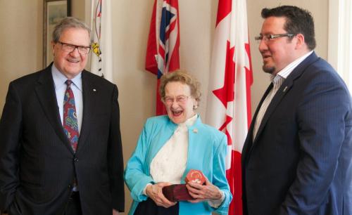 Grace Little, a 96-year-old widower, laughs after receiving a gift from Derek Nepinak (right), Grand Chief of the Assembly of Manitoba Chiefs. The two met for the first time at the University of Winnipeg on Wednesday and chatted with school President Lloyd Axworthy. Nepinak was one of the recipients of Little's scholarship fund for aboriginal youth. Story by Sanders - 120509 - Wednesday, May 09, 2012 -  Melissa Tait / Winnipeg Free Press