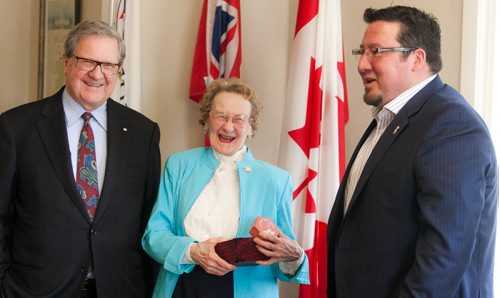 Grace Little, a 96-year-old widower, laughs after receiving a gift from Derek Nepinak (right), Grand Chief of the Assembly of Manitoba Chiefs. The two met for the first time at the University of Winnipeg on Wednesday and chatted with school President Lloyd Axworthy. Nepinak was one of the recipients of Little's scholarship fund for aboriginal youth.  story by Sanders - 120509 - Wednesday, May 09, 2012 -  Melissa Tait / Winnipeg Free Press