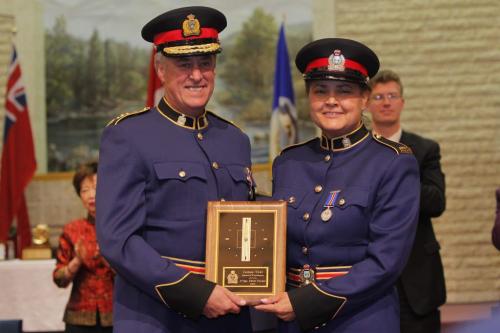 Patrol Sgt. Edith Turner gets the James Toal Award of Excellence, highest honour in the WPS, from Winnipeg Police Service Chief Keith McCaskill.  May 11, 2012  BORIS MINKEVICH / WINNIPEG FREE PRESS