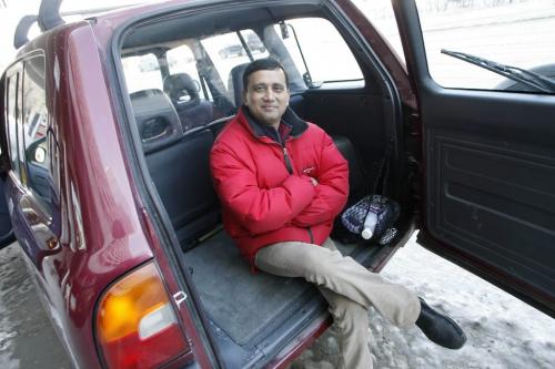 John Woods / Winnipeg Free Press / February 11/07- 070211  - Anand Nakum, Unicity cab driver, sits in the back of his Toyota Rav 4 SUV taxi on St Mary Avenue Sunday Feb 11/07.
