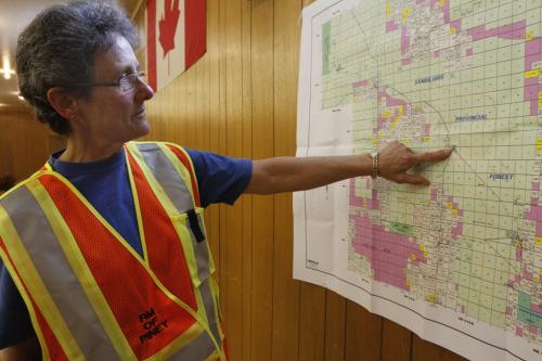 Donna Stewart of Badger, MB, traces the progression of the forest fires towards the town of Badger, which was evacuated the previous night. Several fires are currently being fought in southeastern Manitoba. May 14, 2012. SARAH O. SWENSON / WINNIPEG FREE PRESS