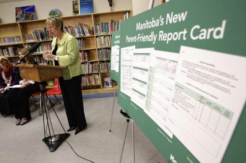 Education minister Nancy Allan presents a new parent-friendly report card in the library at Sister MacNamara school. The new report card is written in plain language that will make student achievement clearer for parents.   120515 May 15, 2012 Mike Deal / Winnipeg Free Press