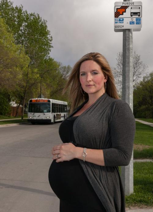 At eight months pregnant Desirae Stewart said she hasn't once been offered a seat on her 45-minute bus ride to work.  120514 - Monday, May 14, 2012 -  Melissa Tait / Winnipeg Free Press