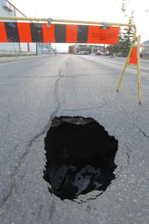 WINNIPEG, MB - A sink hole on William Ave. just west of McPhillips.  May 17, 2012  BORIS MINKEVICH / WINNIPEG FREE PRESS