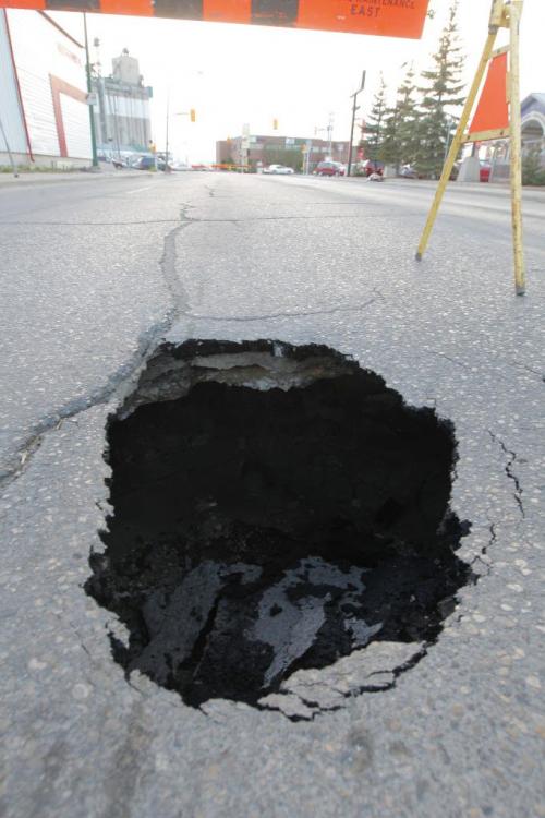 WINNIPEG, MB - A sink hole on William Ave. just west of McPhillips.  May 17, 2012  BORIS MINKEVICH / WINNIPEG FREE PRESS