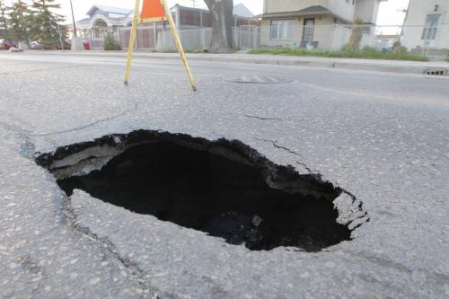 WINNIPEG, MB - A sink hole on William Ave. just west of McPhillips.  May 17, 2012  BORIS MINKEVICH / WINNIPEG FREE PRESS