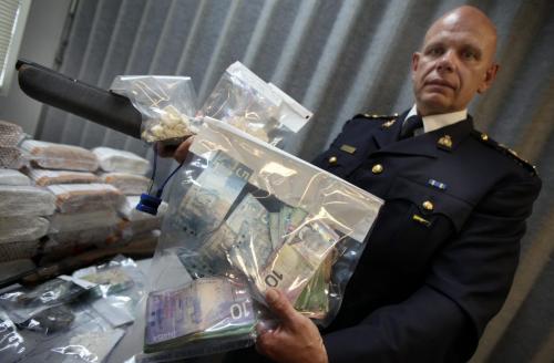 Chief Superintendent Scott Kolody holds part of a collection of evidence from "Project Demerit" exhibited to media at the Portage la Prairie RCMP Detachment Friday morning. See release and Gabriella's story. May 18, 2012 - (Phil Hossack / Winnipeg Free Press)