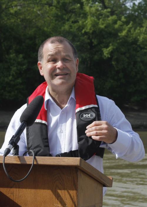 Healthy Living, Seniors and Consumer Affairs Minister Jim Rondeau shows off his personal floatation device (PFD) during a media call at The Forks on Friday. The province proclaimed May 19-25 as Safe Boating Awareness Week and Rondeau was on hand, along with members of the Lifesaving Society to stress the importance of PFDs and their proper use. May 18, 2012. SARAH O. SWENSON / WINNIPEG FREE PRESS