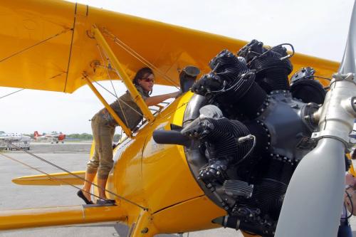 WINNIPEG, MB -Vintage Wings Natalia Gadomska, Western Canada Division rep, gives the Boeing Stearman a little cleaning at the airport. May 18, 2012  BORIS MINKEVICH / WINNIPEG FREE PRESS