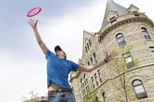 Weston Qualls jumps for a frisbee on the University of Winnipeg grounds on Friday. Many people were out and about enjoying the weather before tomorrows expected showers and a mostly mild and cloudy long weekend (c/o Weather Network forecast as of 1700hrs). May 18, 2012. SARAH O. SWENSON / WINNIPEG FREE PRESS