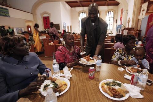 May 20, 2012 - 120520  -  John Agor and other South Sudanese men serve meals to community women at St Matthews Anglican Church Sunday May 20, 2012.  This is a break from Sudanese tradition as men do not cook or serve women. John Woods / Winnipeg Free Press