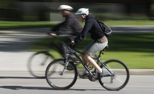 A pair of cyclist make their way along Wellington Crescent, Sunday,  May 20, 2012. (TREVOR HAGAN/WINNIPEG FREE PRESS)