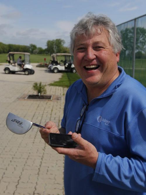 The former founder of Jazz Golf has partnered with Accuform, a digital golf company, on technology that measures hand pressure on the grip of a club and provides immediate data feedback (for teaching purposes) but that's just the entry point. He says the same technology can be used for measuring trauma after hits on the hockey rink or football field. Photo taken at Assiniboine Golf Course of Terry Hashimoto holding a club, ball, and iPhone. May 23, 2012  BORIS MINKEVICH / WINNIPEG FREE PRESS