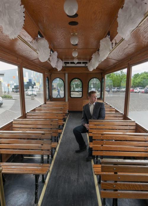 The trolley has returned to Winnipeg after more than 50 years. Ben Gillies, co-owner of the Winnipeg Trolley Company, sits in a 1920s styled streetcar on Friday. It's modelled to look like the very same trolleys that travelled Winnipeg's streets in the early 20th century, and is available for charters and tours.120525 - Friday, May 25, 2012 -  Melissa Tait / Winnipeg Free Press