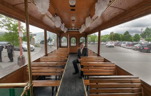 The trolley has returned to Winnipeg after more than 50 years. Ben Gillies, co-owner of the Winnipeg Trolley Company, sits in a 1920s styled streetcar on Friday. It's modelled to look like the very same trolleys that travelled Winnipeg's streets in the early 20th century, and is available for charters and tours. 120525 - Friday, May 25, 2012 -  Melissa Tait / Winnipeg Free Press