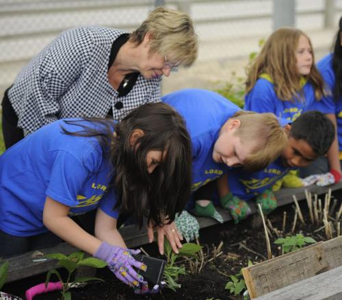WINNIPEG, MB - Lord Nelson School student Sara Burazor helps Manitoba Education Minister Nancy Allan prepare a plant to be put in a garden in front of school on Monday, May, 28th, 2012.. Allan helped children plant and toured the garden created by students and teachers with support from a provincial Education for Sustainable Development Grant. Photo by Cole Breiland/ WInnipeg Free Press