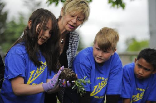 WINNIPEG, MB - Lord Nelson School student Sara Burazor helps Manitoba Education Minister Nancy Allan prepare a plant to be put in a garden in front of school on Monday, May, 28th, 2012.. Allan helped children plant and toured the garden created by students and teachers with support from a provincial Education for Sustainable Development Grant. Photo by Cole Breiland/ WInnipeg Free Press