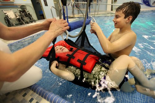 Quinn volunteerss at St. Amant Centre in the pool helping clients after a swim to be rassed out of the pool. See Doug Speirs story Windsor School 2017 project. May 28  2012 (Ruth Bonneville/Winnipeg Free Press)