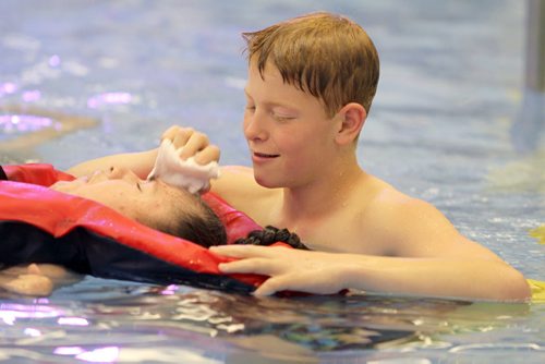 Griffin volunteerss at St. Amant Centre in the pool helping clients enjoy a swim in the water. See Doug Speirs story Windsor School 2017 project. May 28  2012 (Ruth Bonneville/Winnipeg Free Press)