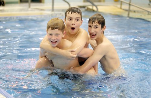 Grade 7 students from right Griffin and Quinn as well as fellow volunteer(Windsor grade 8 student) Donovan Armstrong horse around in the pool at St. Amand Centre after they finished helping St. Amant Centre clients swim in the pool. See Doug Speirs story Windsor School 2017 project. May 28  2012 (Ruth Bonneville/Winnipeg Free Press)