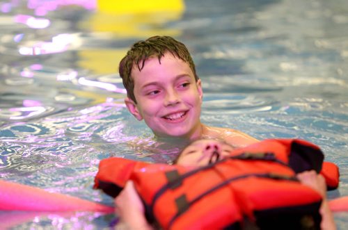 Quinn volunteerss at St. Amant Centre in the pool helping clients enjoy a swim in the water. See Doug Speirs story Windsor School 2017 project. May 28  2012 (Ruth Bonneville/Winnipeg Free Press)