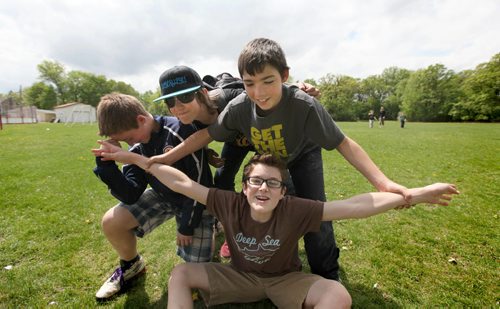 Windsor school grade seven boys from left Jesse, Garrett, Thomas and Noah (brown shirt) goof around in the school grounds just before heading into school after lunch break.   See Doug Speirs story Windsor School 2017 project. May 28  2012 (Ruth Bonneville/Winnipeg Free Press)