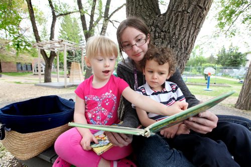 Julianna reads a book to children from St. Amant Daycare during one of her volunteer days. (upon request the names of the kids are not included) See Doug Speirs story Windsor School 2017 project. May 28  2012 (Ruth Bonneville/Winnipeg Free Press)