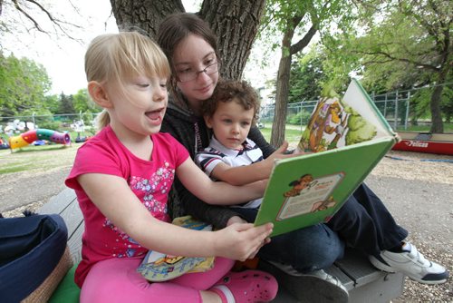 Julianna reads a book to children from St. Amant Daycare during one of her volunteer days. (upon request the names of the kids are not included) See Doug Speirs story Windsor School 2017 project. May 28  2012 (Ruth Bonneville/Winnipeg Free Press)