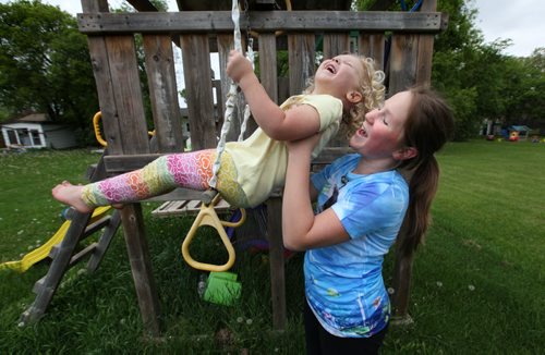 Sarah always enjoys helping out at home with babysitting her young siblings, cousins and neighbors that come play in her yard after school. See Doug Speirs story Windsor School 2017 project. May 28  2012 (Ruth Bonneville/Winnipeg Free Press)