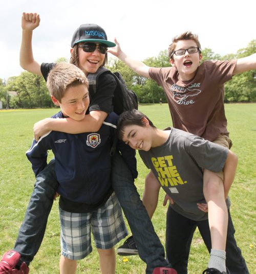 Windsor school grade seven boys from left Jesse, Garrett, Thomas and Noah (brown shirt) goof around in the school grounds just before heading into school after lunch break.   See Doug Speirs story Windsor School 2017 project. May 28  2012 (Ruth Bonneville/Winnipeg Free Press)
