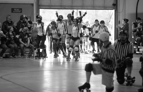 Brandon Sun Members of the Wheat City Roller Derby League's Gang Greens enter Building L-25 at CFB Shilo for their first ever bout against the visiting Moose Jaw Jaw Breakers for the Lil Chicago Roller Derby Club, last Saturday evening. (Bruce Bumstead/Brandon Sun)
