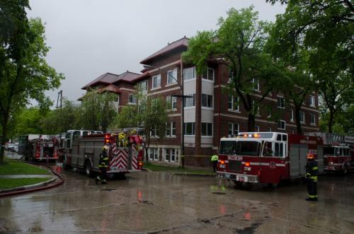 Fire crews and emergency workers respond to a fire in the King George Court apartment building at the corner of Cockburn Avenue and Jessie Avenue in the Corydon area of Winnipeg on May, 29, 2012.  Smoke was seen coming from a second-story window in the rear of the building. (Photo by Cole Breiland/ Winnipeg Free Press) Winnipeg Free Press