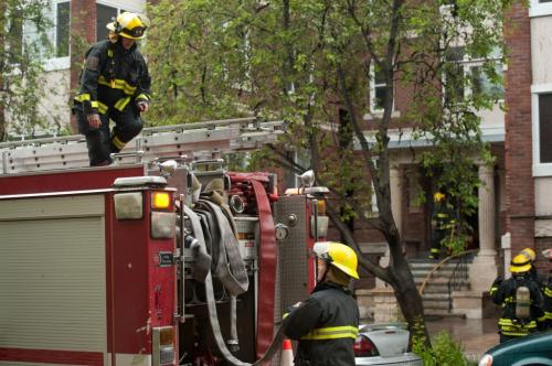 Fire crews and emergency workers respond to a fire in the King George Court apartment building at the corner of Cockburn Avenue and Jessie Avenue in the Corydon area of Winnipeg on May, 29, 2012.  Smoke was seen coming from a second-story window in the rear of the building. (Photo by Cole Breiland/ Winnipeg Free Press) Winnipeg Free Press