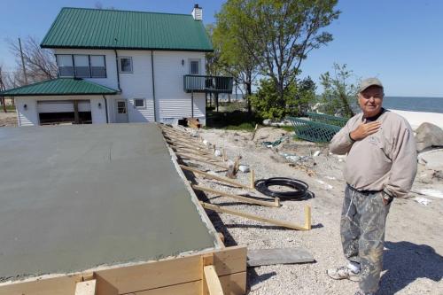 Garry Grubert at Twin Lakes Beach, Lake Manitoba flood damage area. His house is going to be slid on the new pad he poured. May 30,  2012  BORIS MINKEVICH / WINNIPEG FREE PRESS