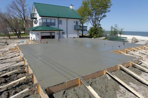 Twin Lakes Beach, Lake Manitoba flood damage area. A house is going to be slid on the new pad that was poured. May 30,  2012  BORIS MINKEVICH / WINNIPEG FREE PRESS